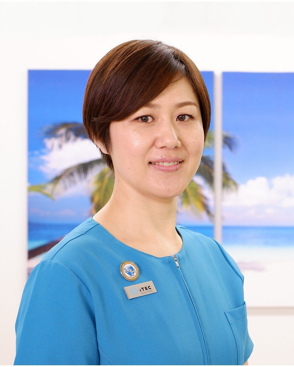 Mio Sekino, instructor, in a Magic Hands Therapist Academy uniform with an ITEC-qualified badge